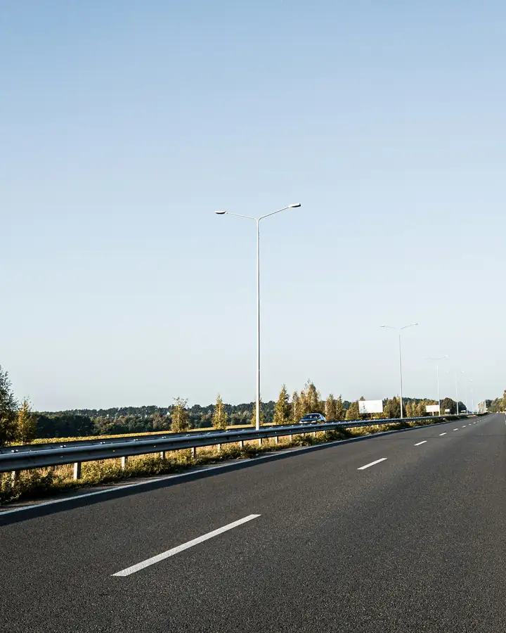 Open highway under a clear blue sky