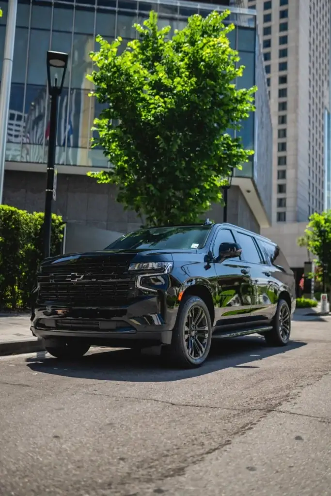 Black Chevrolet SUV on a city street